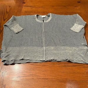 Women’s Cabi zip up short sleeved sweater size small. Has ties on side see pics